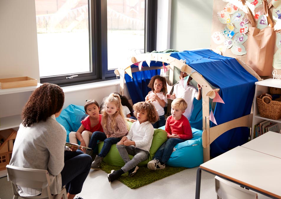 female-infant-school-teacher-sitting-on-a-chair